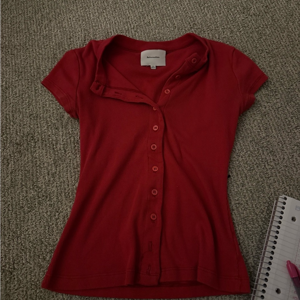 SOLD ON DEPOP! Do not buy!


Reformation red button up top , raye top size xs